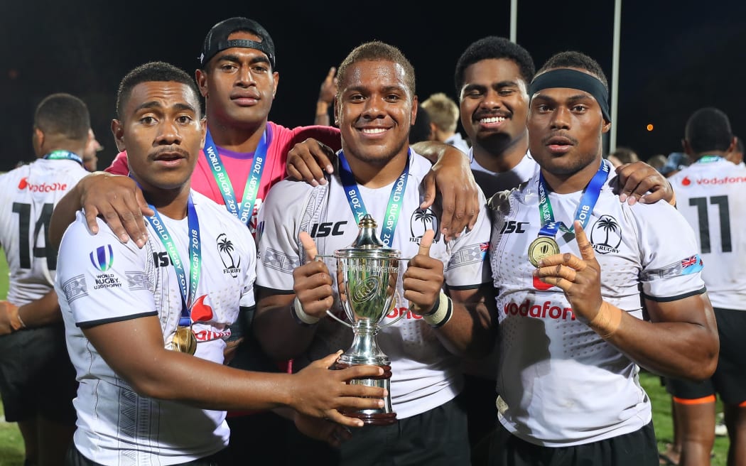 The Baby Flying Fijians celebrate with the U20 trophy.