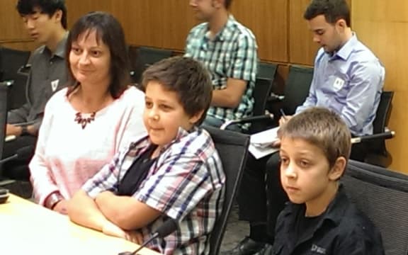 From left, boys' mother Mel Pipsen, Sean Roberts, Cody Roberts.