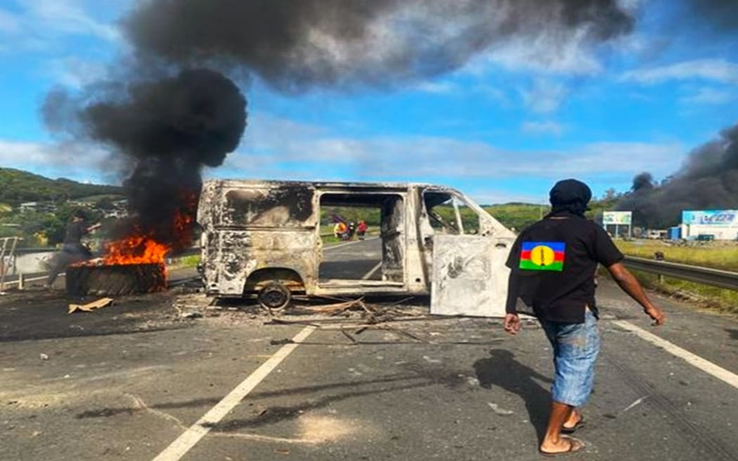 Burnt van and tyres at one roadblock near Nouméa’ Magenta industrial zone