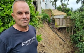 The slip on Karl Browne's neighbour's property that opened up after heavy rains caused flooding and damage throughout Auckland. 30 January 2023