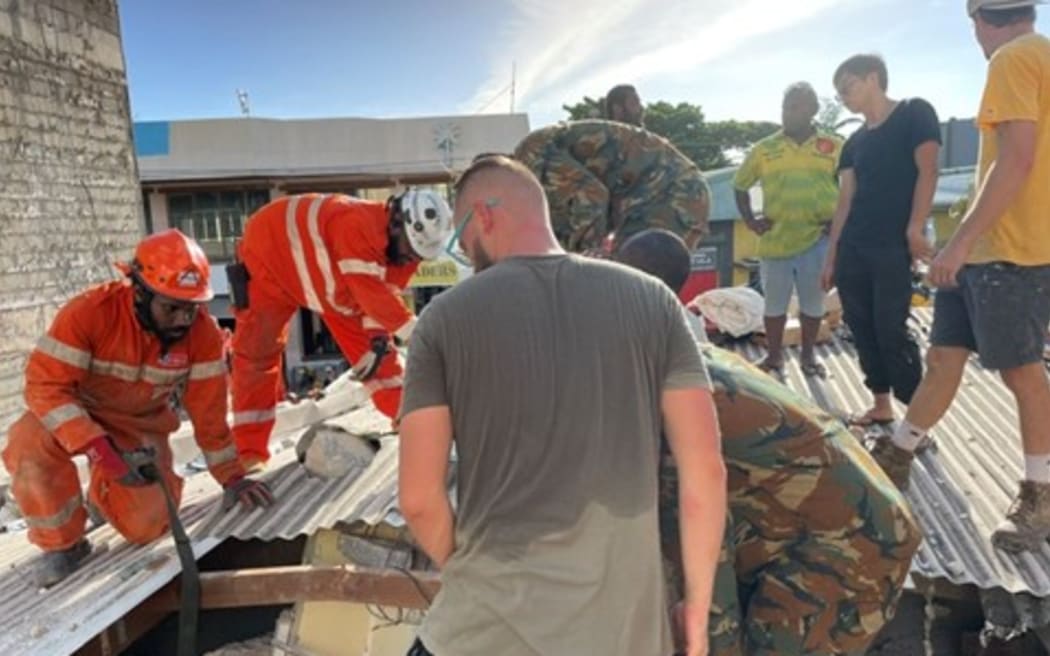 VMF personnel and emergency services work together in the aftermath of the December earthquake.