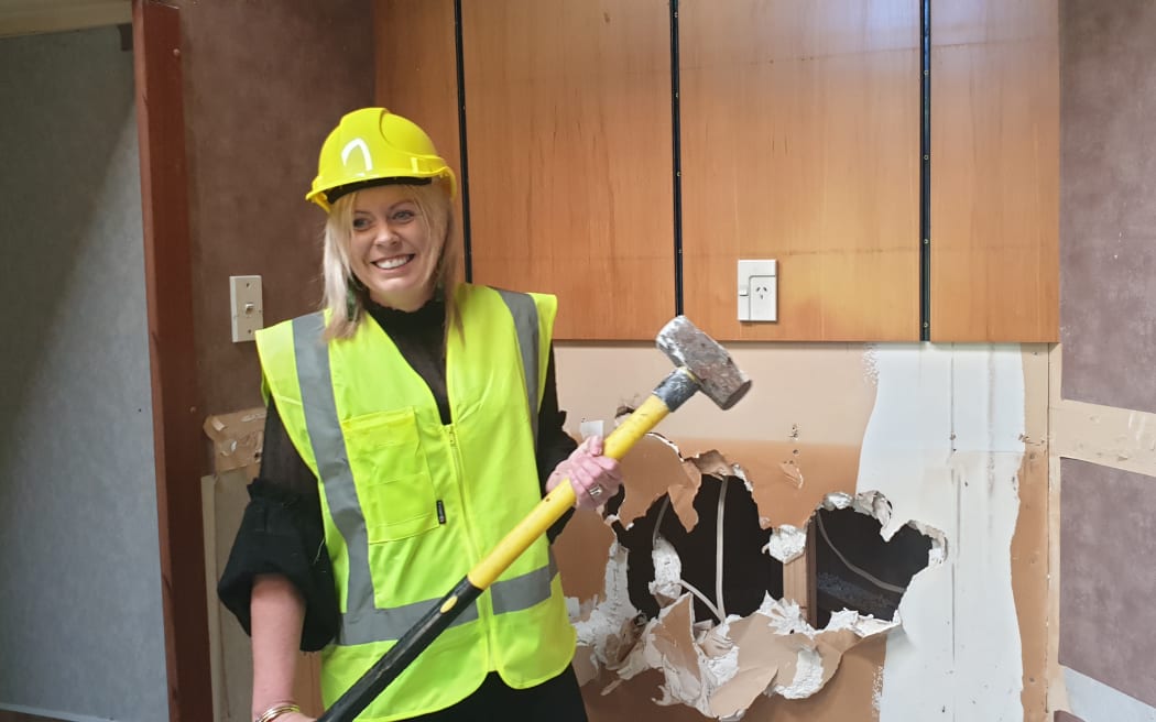 Melissa Vining was the first to strike the sledgehammer.