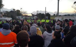Protesters and police at Ihumatao.