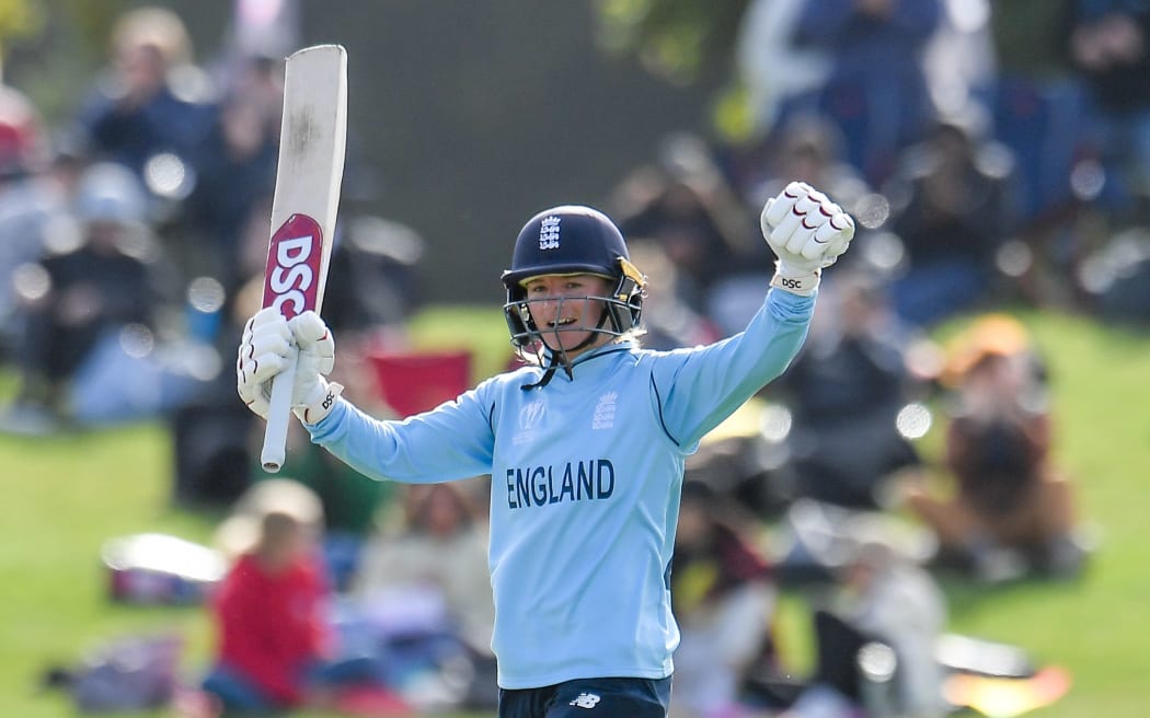 Danielle Wyatt of England celebrates a century.