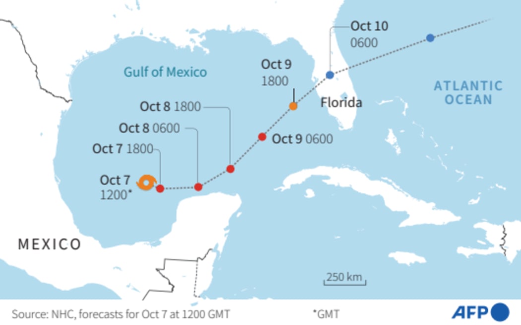 Map showing the forecast trajectory of Hurricane Milton in the Gulf of Mexico, according to the US National Hurricane Center(NHC) as of October 7 at 1200 GMT. / AFP / Jean-Michel CORNU