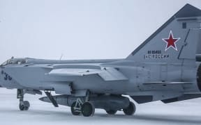 This handout video grab released by the Russian Defence Ministry on February 19, 2022, shows a MiG-31K fighter of the Russian air force carrying a Kinzhal hypersonic cruise missile during the Grom-2022 Strategic Deterrence Force exercise at an undefined location in Russia. Russia on February 19 successfully test-fired its latest hypersonic ballistic missiles, cruise missiles, and nuclear-capable ballistic missiles as part of "planned exercises," the Kremlin said, as tensions soar over Ukraine. (Photo by Handout / Russian Defence Ministry / AFP) / RESTRICTED TO EDITORIAL USE - MANDATORY CREDIT "AFP PHOTO /Russian Defence Ministry" - NO MARKETING - NO ADVERTISING CAMPAIGNS - DISTRIBUTED AS A SERVICE TO CLIENTS