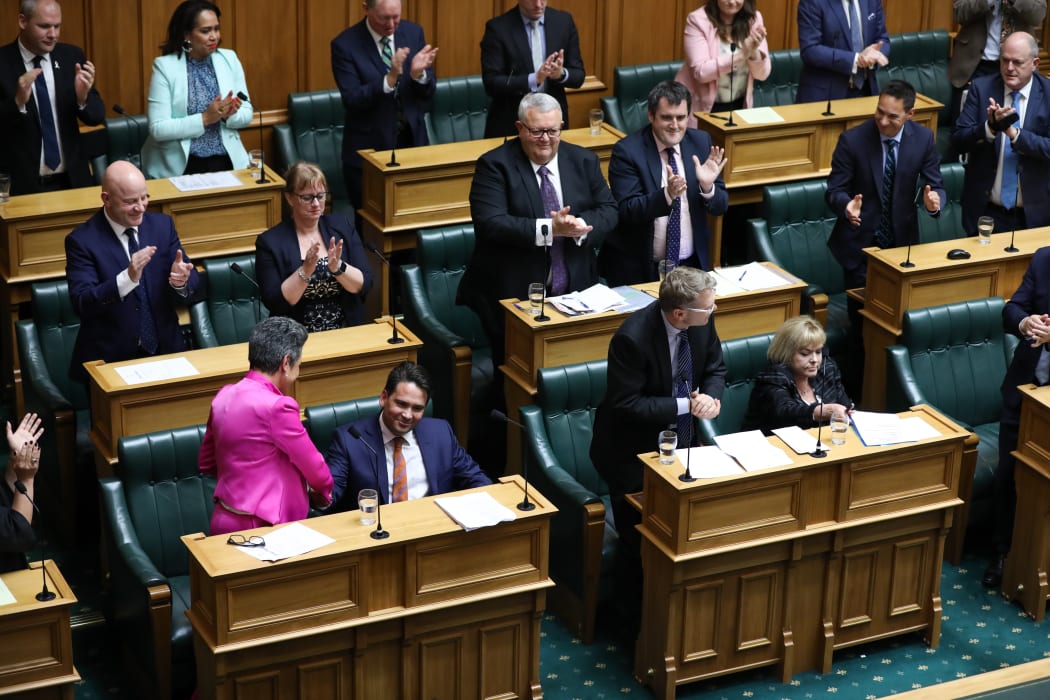 Deputy leader of the National Party Paula Bennett shakes the Party leader Simon Bridges' hand after his speech during the adjournment debate