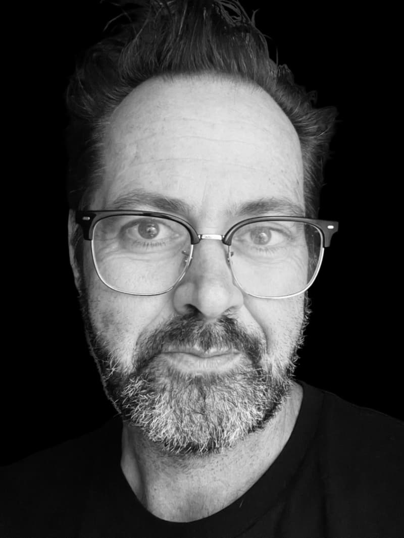 TVNZ sports commentator Scotty 'Sumo' Stevenson is a bearded and bespectacled man with a soft gaze.