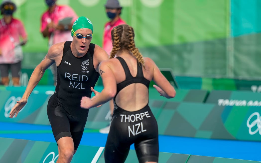New Zealand mixed triathlon team members Tayler Reid and Ainsley Thorpe in action at the Tokyo Olympics.