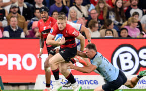 Johnny McNicholl scores against the Waratahs.