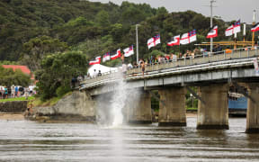 Rangatahi poppin' manus at a Waitangi bridge.