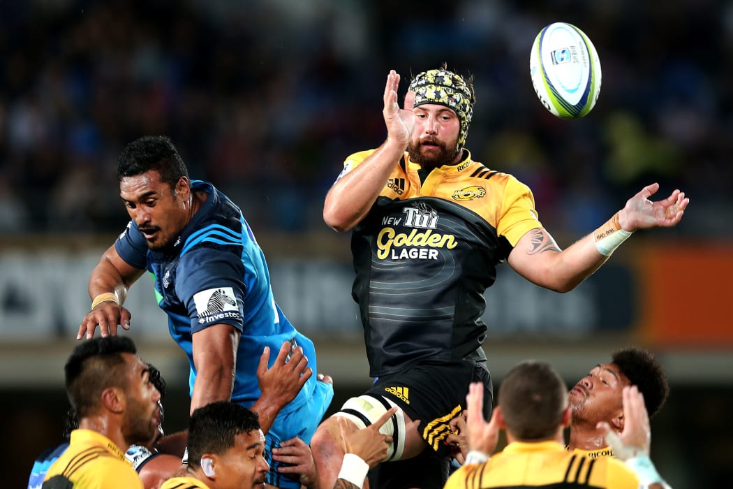 Blade Thomson of the Hurricanes competes at the lineout against Jerome Kaino of the Blues.