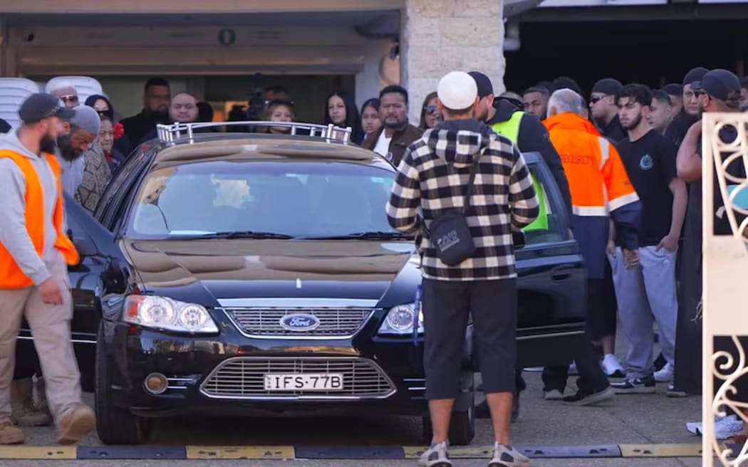 Mourners gather at the funeral of Lorenzo Lemalu (ABC News)