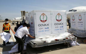 Packages of Covid-19 vaccine arrive at the Phnom Penh International Airport in Cambodia, on 13 December, 2021.
