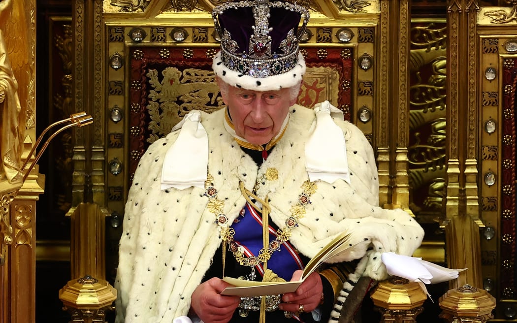 Britain's King Charles III, wearing the Imperial State Crown and the Robe of State, reads the King's Speech from the The Sovereign's Throne in the House of Lords chamber, during the State Opening of Parliament, at the Houses of Parliament, in London, on July 17, 2024.