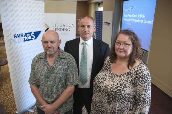 Lawyer Andrew Hooker, centre, with Kiwibank customers Gary Watson and Leanne Briggs.