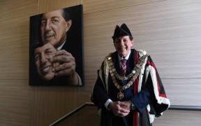 Mayor Shadbolt stands in front of his portrait in November, a piece that is titled Seriously.