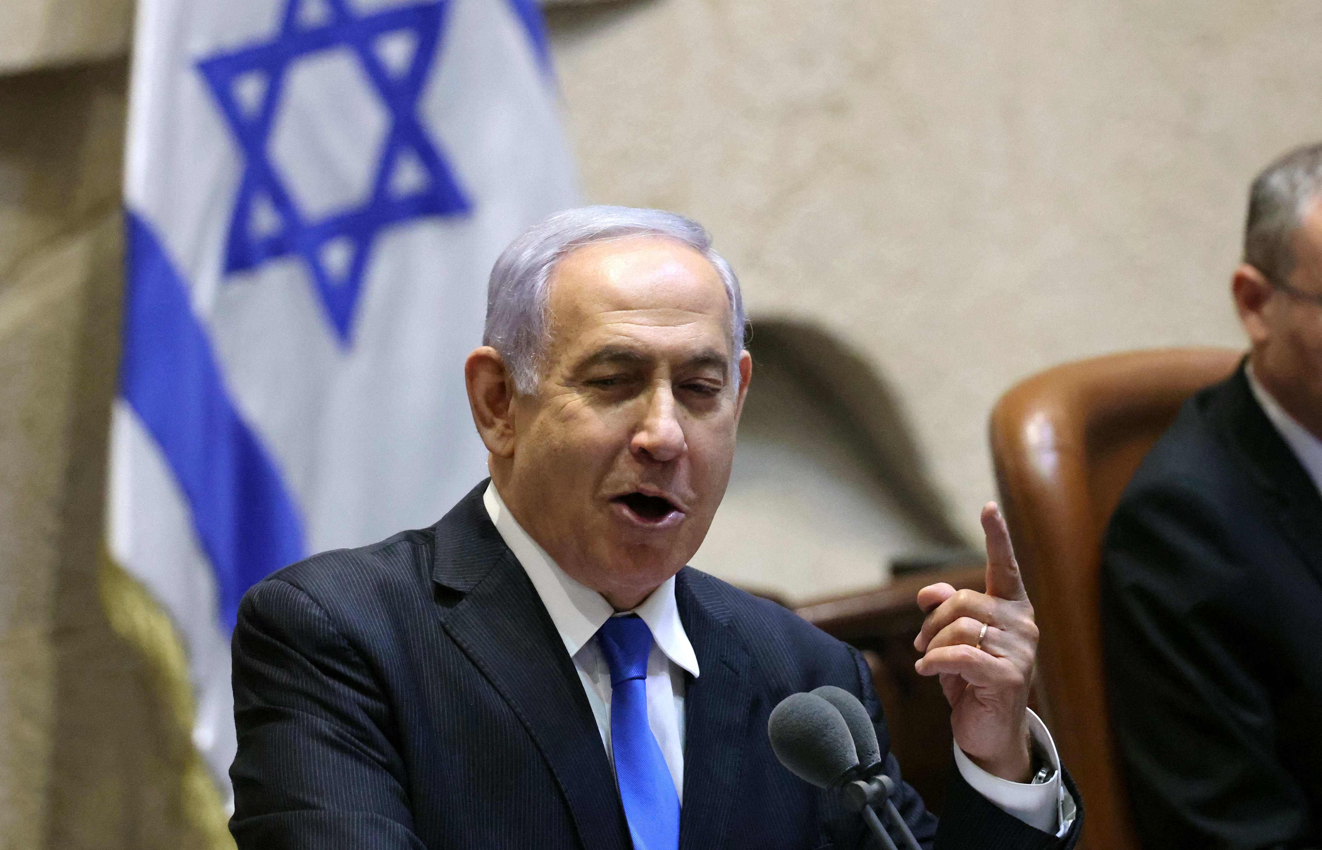 Israel's Prime Minister Benjamin Netanyahu addresses lawmakers during a special session to vote on a new government at the Knesset in Jerusalem, on 13 June 2021.