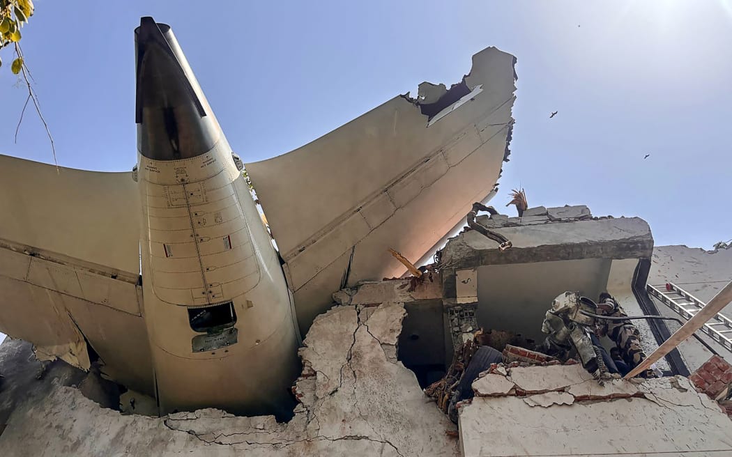 The back of an Air India plane after it crashed in a residential area near the airport in Ahmedabad.