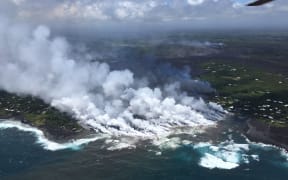 Lava flow from Fissure 8 Kilaua eruption spilling into Kapoho Bay