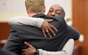 Plaintiff DeWayne Johnson hugs one of his lawyers after hearing the verdict to his case against Monsanto at the Superior Court Of California in San Francisco, California.