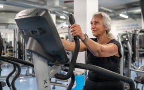 Older woman working out on gym equipment