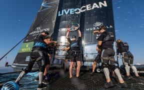 The New Zealand SailGP Team celebrate onboard.