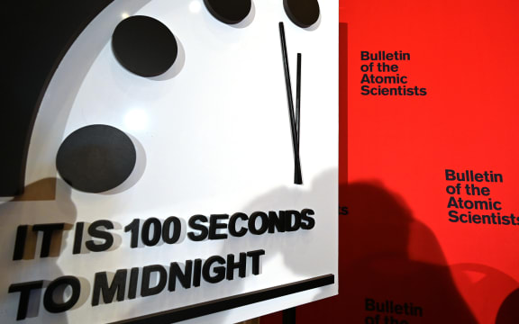 The Doomsday Clock reads 100 seconds to midnight.