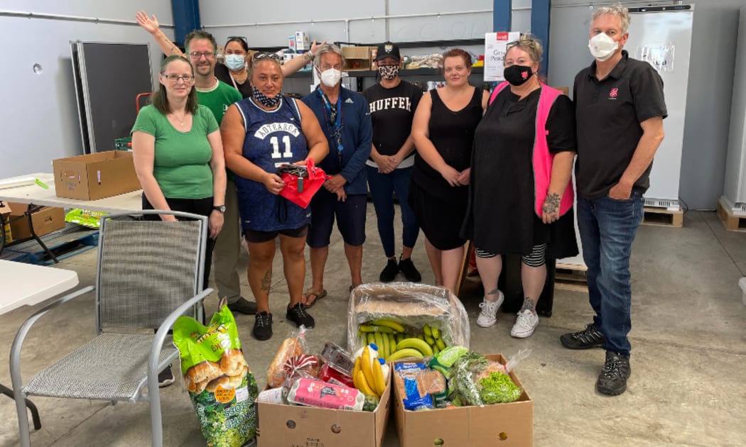 Co-op members all gather once a week to pack the food boxes together in a warehouse next to the Clendon family store.