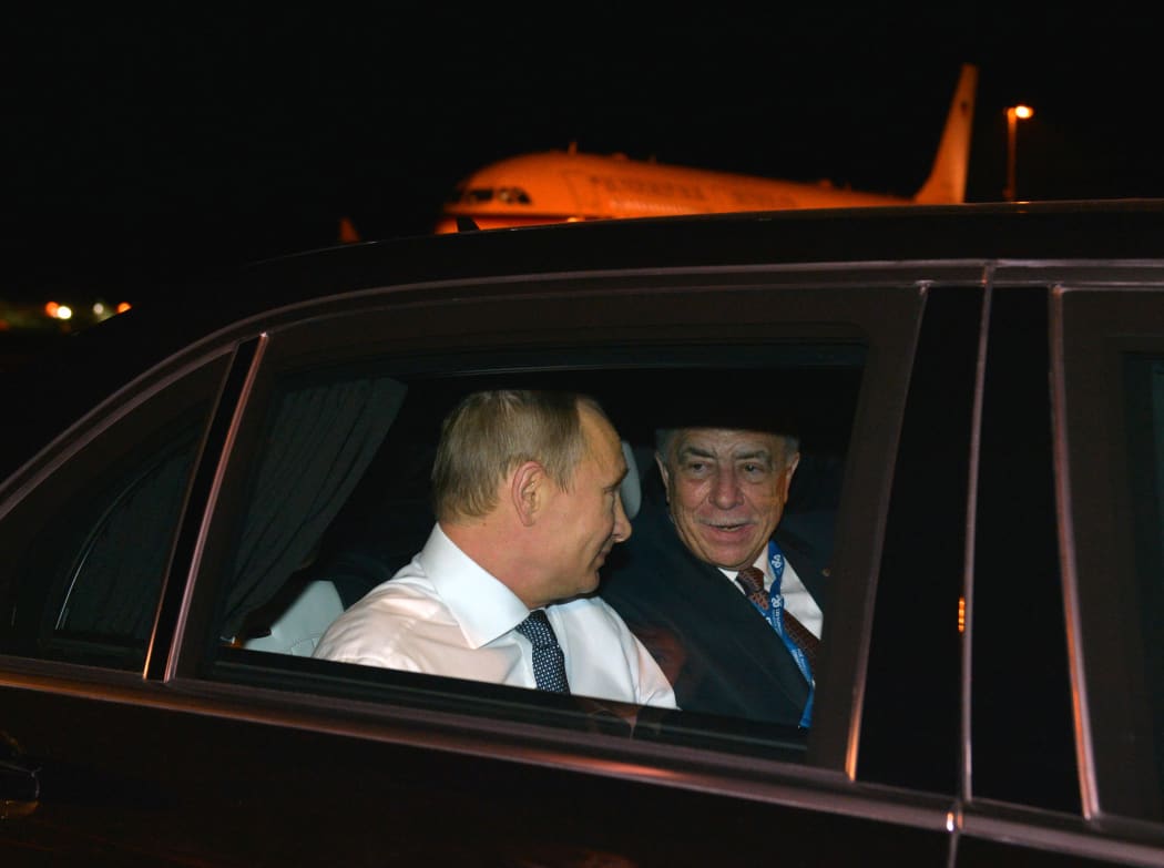 Russian President Vladimir Putin and Russian Ambassador to Australia Vladimir Morozov during the welcoming ceremony in Brisbane.