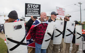 Members of the 'League of the South' line up with shields during a 'White Lives Matter' rally in Shelbyville, Tennessee.