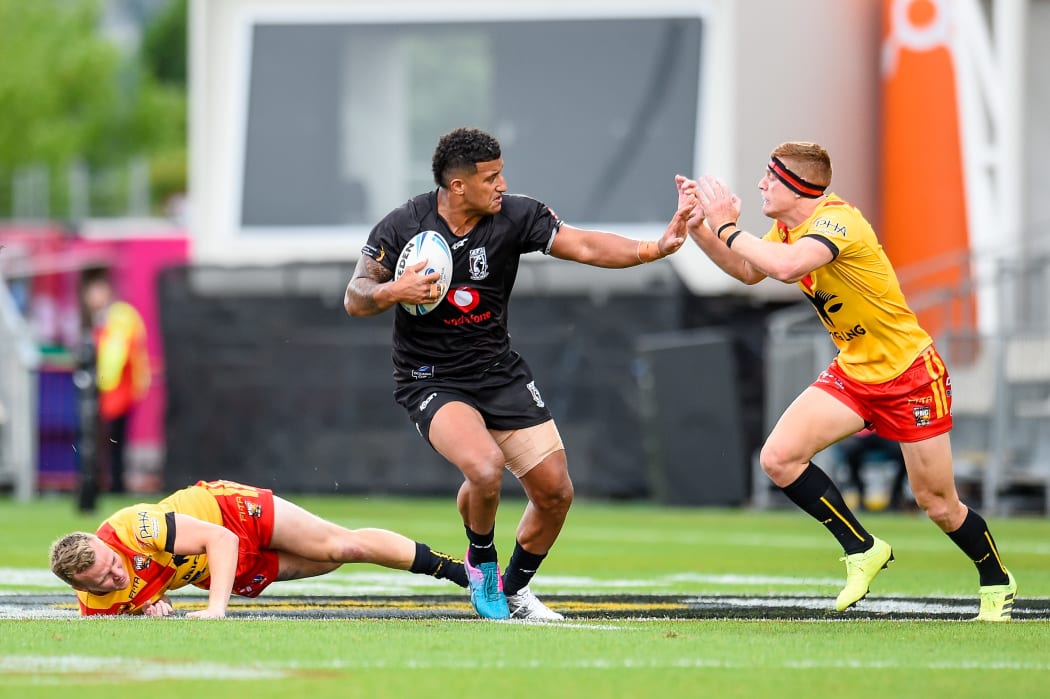 Fiji's Viliame Kikau fends off PNG's Daniel Russell of PNG during their Oceania Cup clash in Christchurch.
