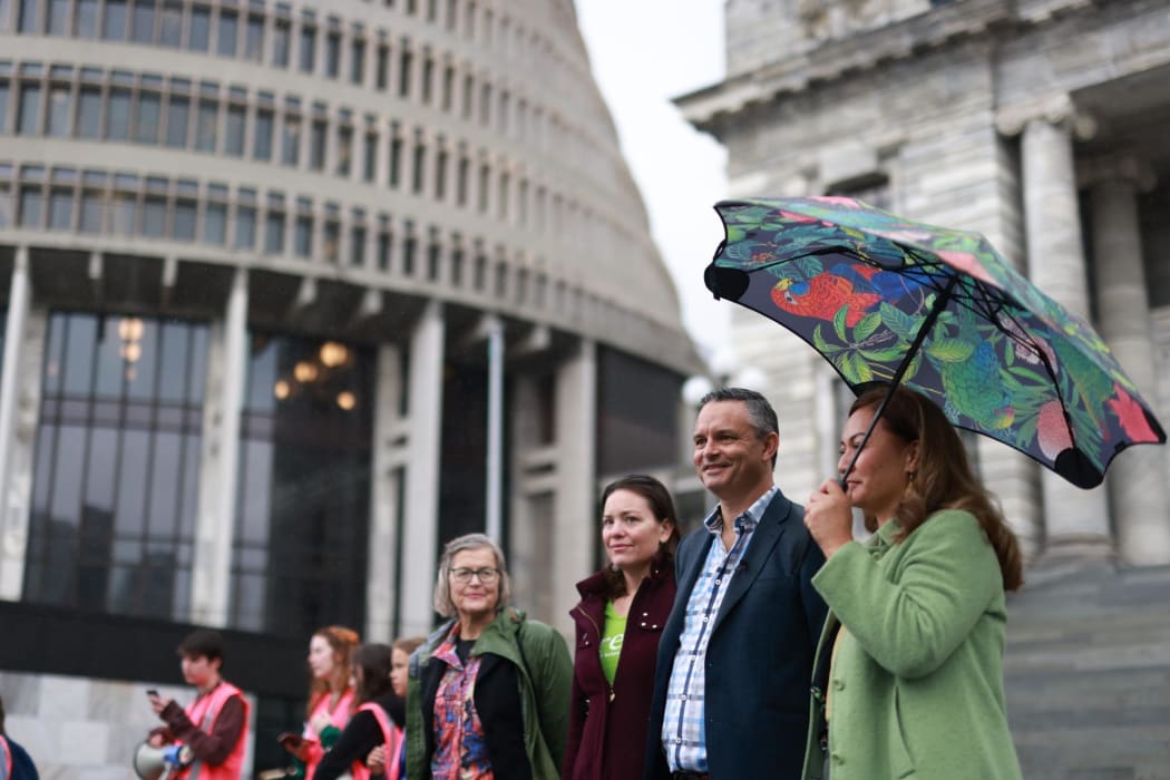 Green Party MPs Eugenie Sage, Julie Anne Genter, with co-leader and Climate Minister James Shaw, and co-leader Marama Davidson, at the steps of Parliament to hear from the gathered climate change protesters.