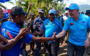 PNG Prime Minister James Marape and Australian Prime Minister Anthony Albanese greet PNG locals