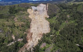 An aerial view of the landslide in Yambali village, in the Highlands of Papua New Guinea, Monday, 27 May, 2024. Authorities fear a second landslide and a disease outbreak are looming at the scene of Papua New Guinea's recent mass-casualty disaster.