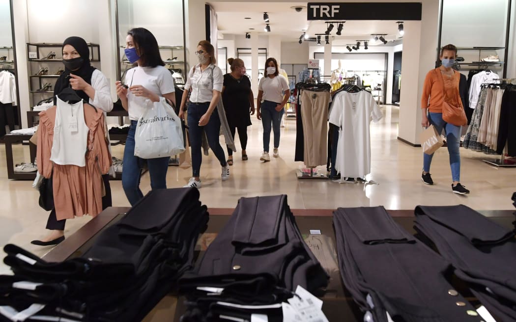 People shoppinh in the Tunisian capital Tunis on 12 May 2020, following the easing of the coronavirus lockdown measures.