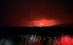 This image released by the US Geological Survey (USGS) on November 28, 2022, shows Mauna Loa eruption as viewed from Waikoloa. - Hawaii's Mauna Loa, the largest active volcano in the world, has erupted for the first time in nearly 40 years, US authorities said, as emergency crews went on alert early Monday. (Photo by Handout / US Geological Survey / AFP) / RESTRICTED TO EDITORIAL USE - MANDATORY CREDIT "AFP PHOTO / US Geological Survey " - NO MARKETING - NO ADVERTISING CAMPAIGNS - DISTRIBUTED AS A SERVICE TO CLIENTS