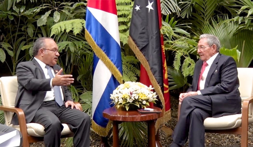 Papua New Guinea Prime Minister Peter O'Neill (left) talks with President of Cuba Raul Castro in Havana.