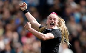 Jorja Miller of New Zealand celebrates scoring a try.