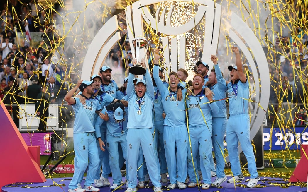 England Captain Eoin Morgan lifts the ICC Cricket World Cup trophy.