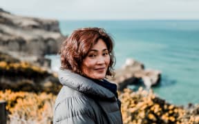 Sue Kim near Tunnel Beach, Ōtepoti.