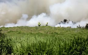 Firefighters battle a blaze in Millwater, Auckland, on 7 November 2025.