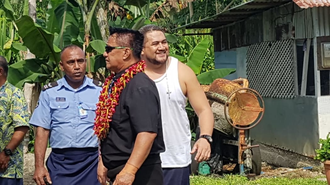 Tulaga (in white shirt) visits crime scene with jury members
