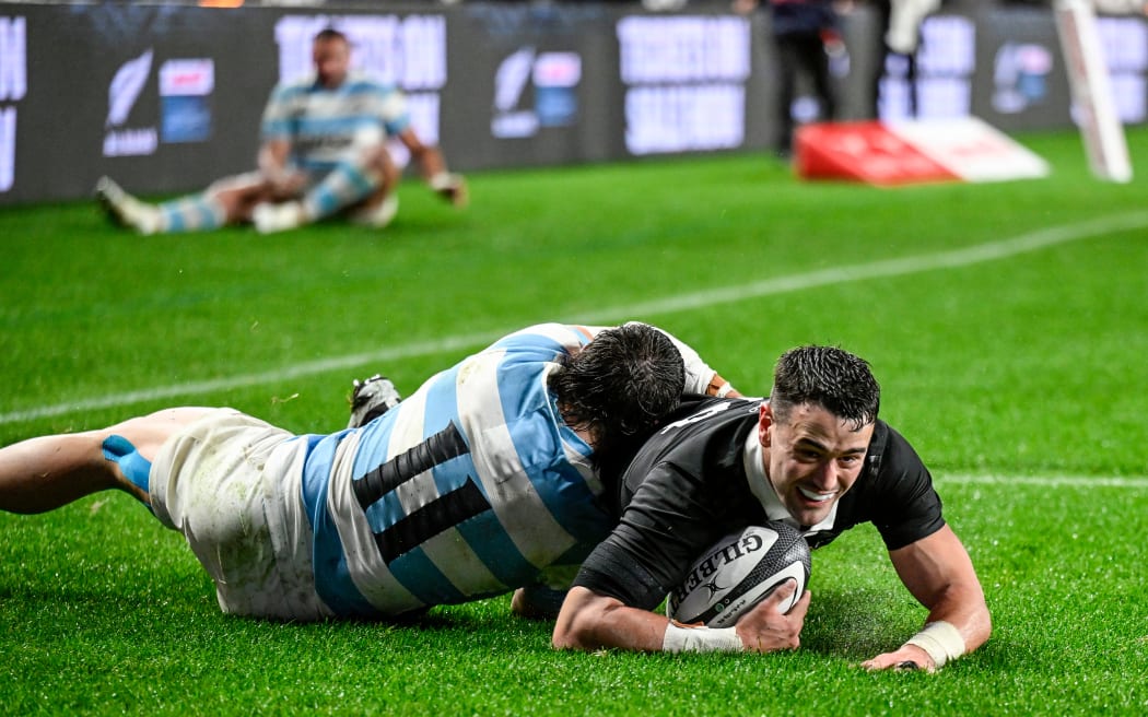 Will Jordan slides in to score a try.