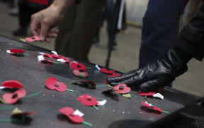 Members of the public laid poppies on the Tomb of the Unknown Warrior following the Wellington dawn service