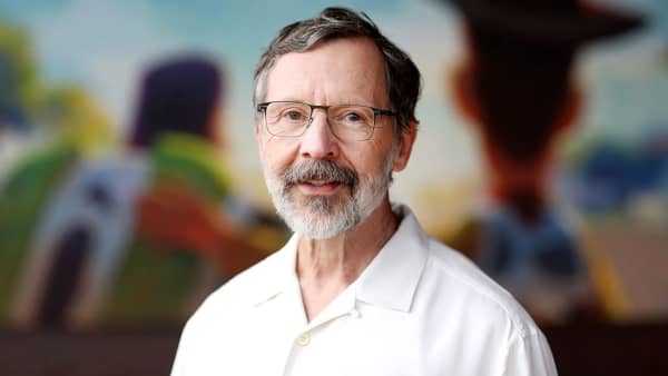 Ed Catmull is a friendly-looking man with a grey beard, glasses and a white polo shirt.