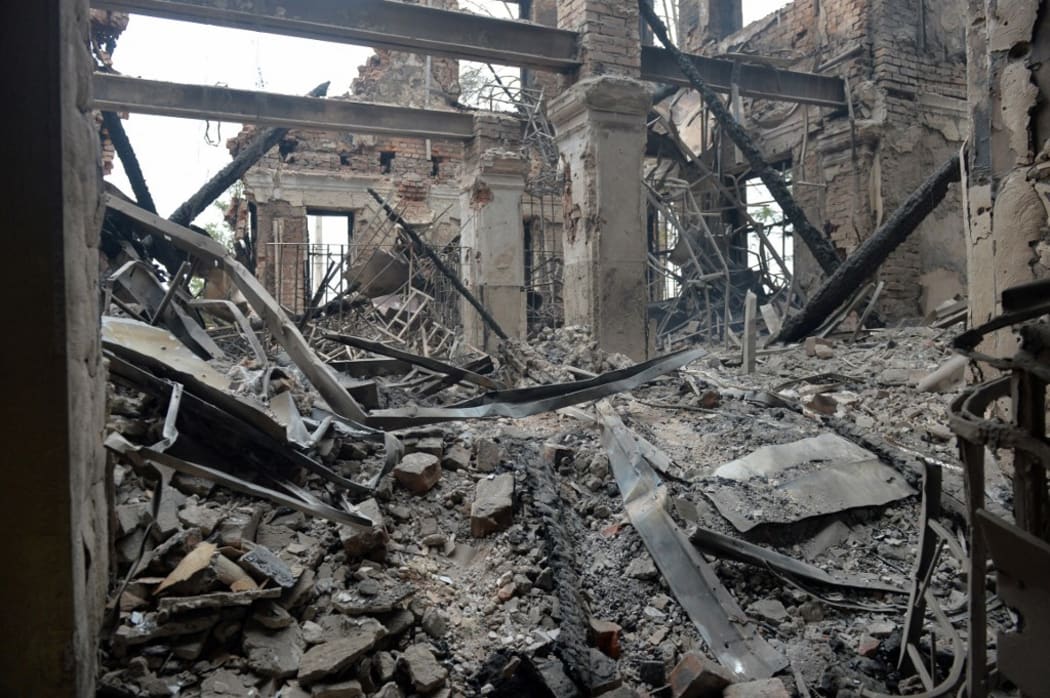 A view of a school destroyed as a result of fighting not far from the centre of the Ukrainian city Kharkiv, located some 50 km from the Ukrainian-Russian border, on 28 February, 2022.