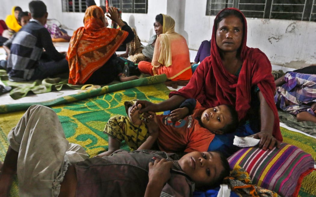 Bangladeshi villagers take refuge in a cyclone shelter in Cox's Bazar district.