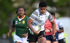 Sesenieli Donu of Fiji makes a break against South Africa at the Women's Rugby World Cup.