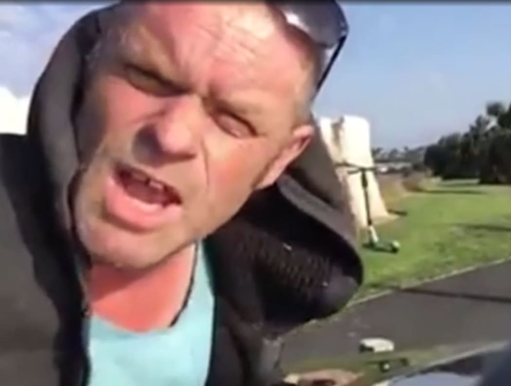 Gary Hughes (52) appears to use a chisel and hammer on the tooth sculpture.